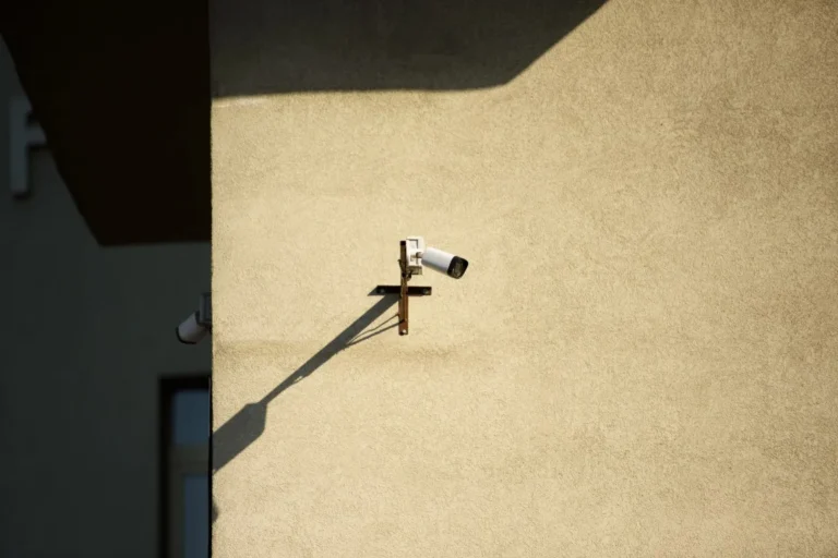 Close up view of security camera on building in sunlight