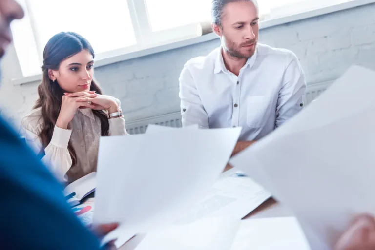 Business people at work with papers