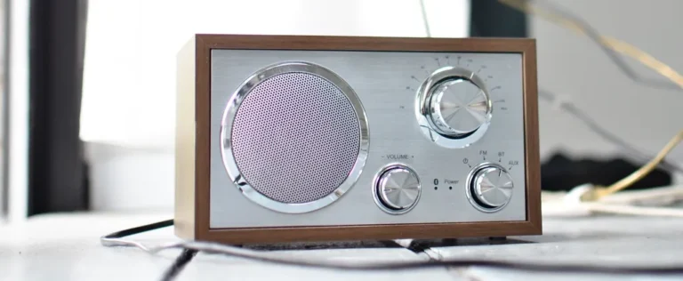 Classic wooden radio with chrome dials and speaker, capturing retro nostalgia indoors